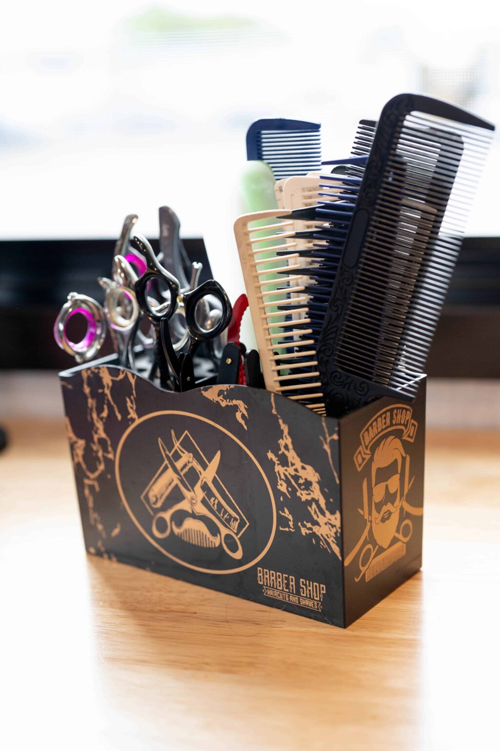 combs and hairstyling shears in a box